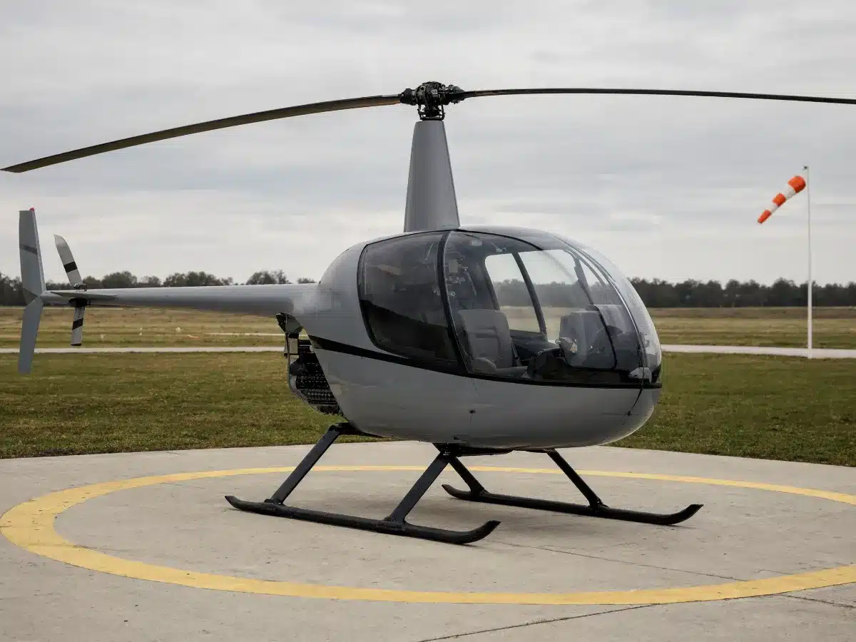A light helicopter on a landing pad